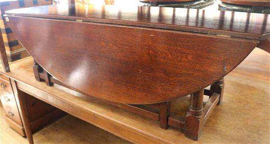 An oak double gateleg coffee table, W.164cm H.46cm